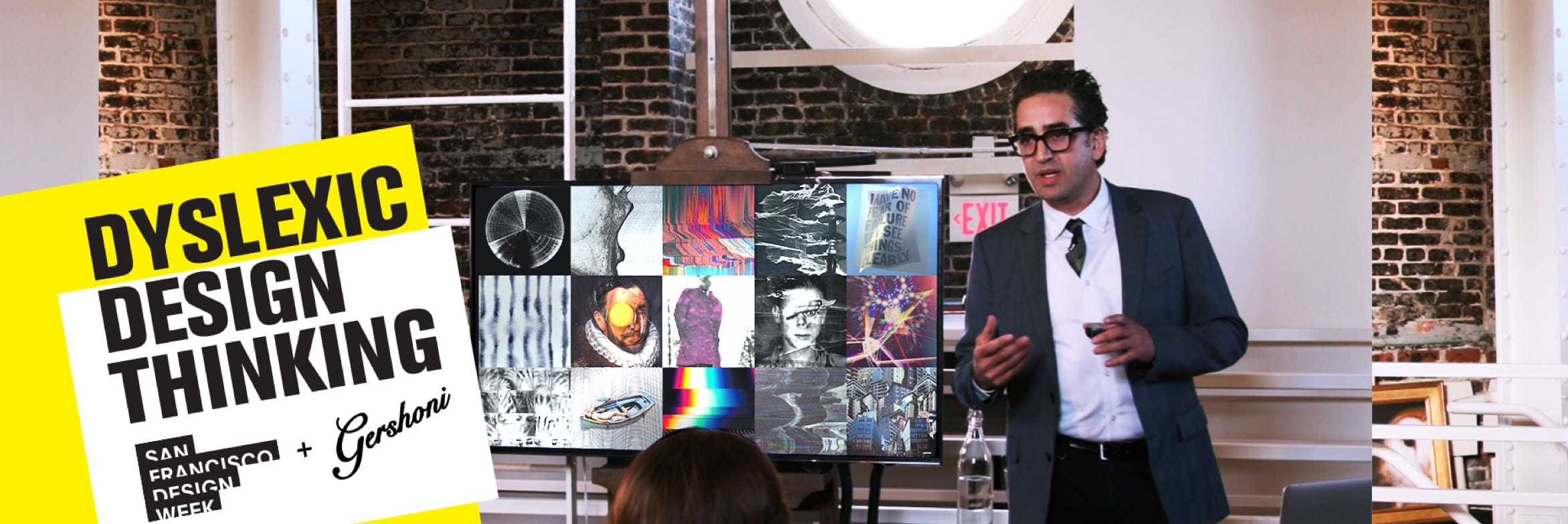 Gil Gershoni giving a lecture at San Francisco Design Week. He is standing in front of a screen filled with distorted images.
