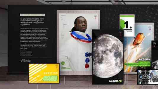 Installation of 8 photographs of astronauts and space exploration displayed on large flat-screens.